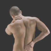 A man with back pain needing an acupuncture treatment at Balance Point.